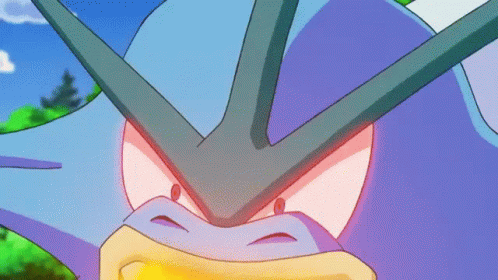 A Close Up Of A Purple And Blue Cartoon Character With Red Eyes GIF