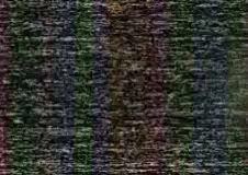 A Close Up Of A Purple And Green Striped Fabric GIF