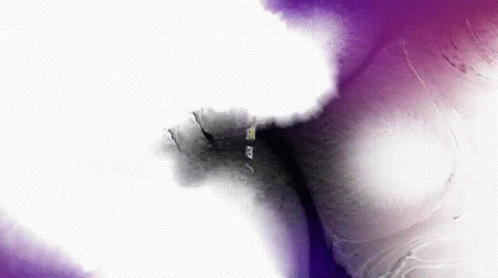 A Close Up Of A Purple And White Background With A Few Dots GIF