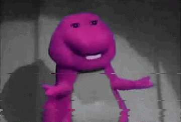 A Close Up Of A Purple Stuffed Animal With A Purple Face . GIF
