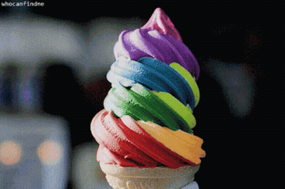 A Close Up Of A Rainbow Colored Ice Cream Cone With The Caption Who Can Find Me GIF