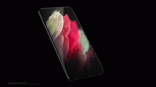 A Close Up Of A Red And Green Colored Surface On A Black Background GIF