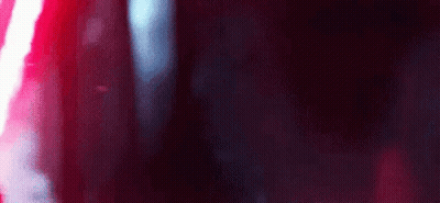 A Close Up Of A Red And White Light On A Black Background . GIF