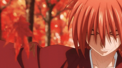 A Close Up Of A Red Haired Anime Character With A Blurred Background GIF
