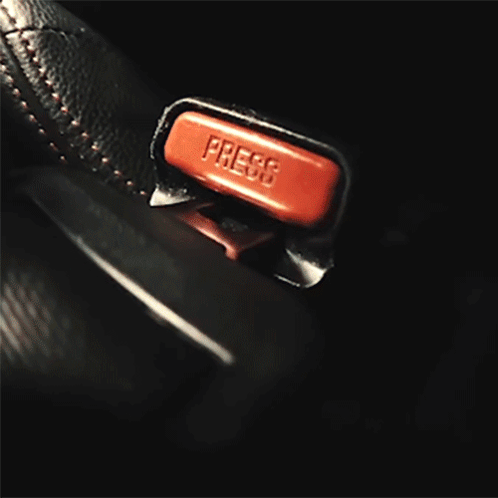 A Close Up Of A Red Light On A Black Object GIF