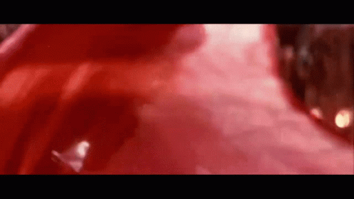 A Close Up Of A Red Object On A Black Background . GIF