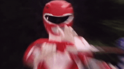A Close Up Of A Red Power Ranger Making A Funny Face . GIF