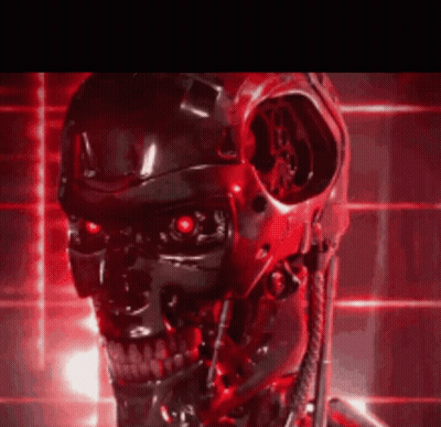 A Close Up Of A Robot 'S Head With Red Lights Behind It GIF