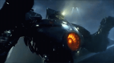 A Close Up Of A Robot With A Red Light Coming Out Of It 'S Mouth . GIF
