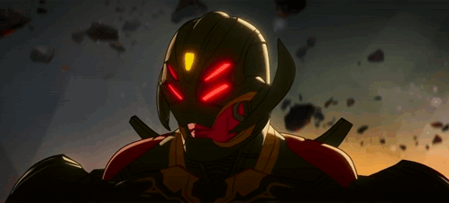 A Close Up Of A Robot With Red Lights On His Eyes GIF