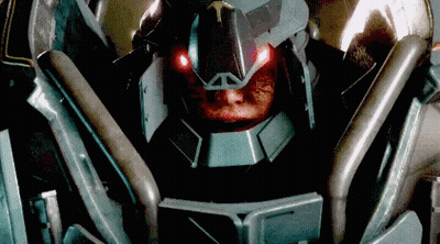 A Close Up Of A Robot With Red Lights On Its Eyes GIF