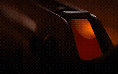 A Close Up Of A Rocket With A Yellow Light In The Background GIF