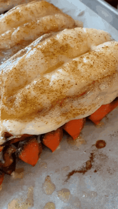 A Close Up Of A Sandwich With Carrots On A Tray GIF