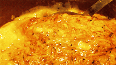 A Close Up Of A Sauce With A Spoon GIF