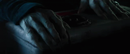 A Close Up Of A Scary Face With Red Eyes GIF