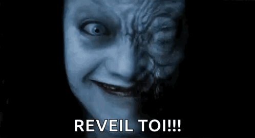 A Close Up Of A Scary Face With The Words `` Reveal To ! '' GIF
