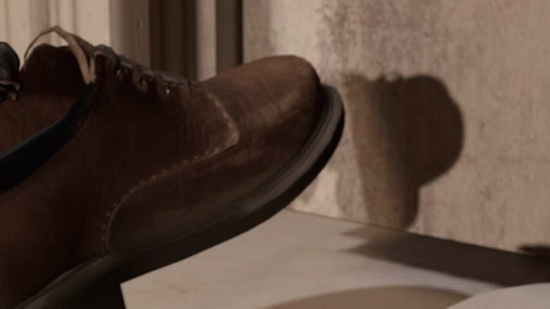 A Close Up Of A Shoe 'S Sole On A Concrete Surface GIF