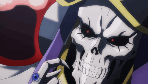 A Close Up Of A Skeleton With Red Eyes And A Ring On His Finger GIF