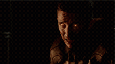 A Close Up Of A Skull With Flames Coming Out Of It GIF