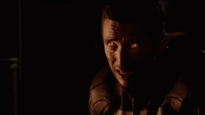 A Close Up Of A Skull With Flames Coming Out Of It 'S Head GIF