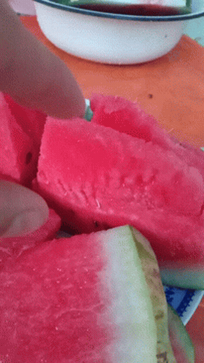 A Close Up Of A Slice Of Watermelon On A Plate GIF