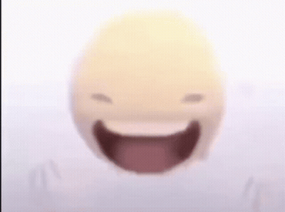 A Close Up Of A Smiley Face With Its Mouth Open And Tongue Out . GIF