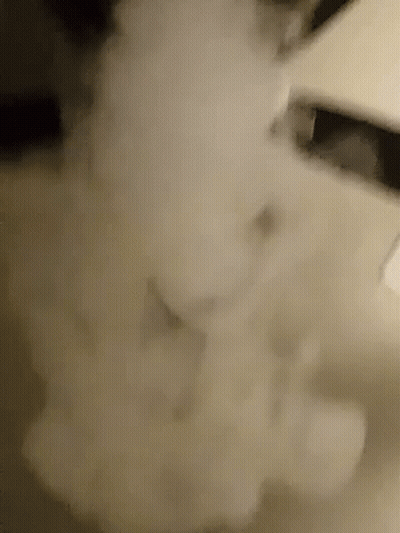 A Close Up Of A Smoke Coming Out Of A Pipe GIF