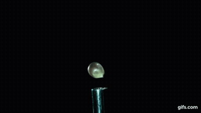 A Close Up Of A Smoke Coming Out Of A Test Tube With Gifs.com Written On The Bottom GIF