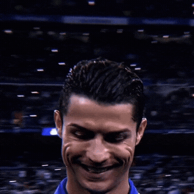 A Close Up Of A Soccer Player 'S Face With A Crowd Behind Him GIF