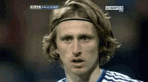 A Close Up Of A Soccer Player Wearing A Headband And Looking At The Camera . GIF