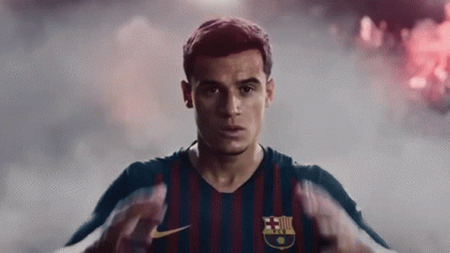 A Close Up Of A Soccer Player Wearing A Striped Jersey GIF