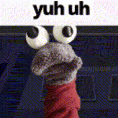 A Close Up Of A Sock Puppet With Big Eyes And The Words Yuh Uh Above It . GIF