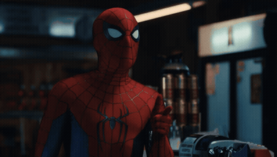A Close Up Of A Spider Man Giving A Thumbs Up Sign GIF