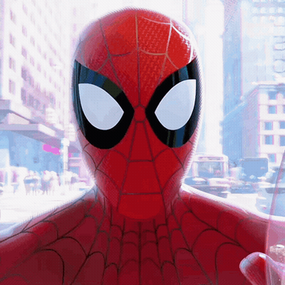 A Close Up Of A Spider Man 'S Face With A City Background GIF