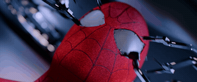 A Close Up Of A Spider Man 'S Face With A Hole In It GIF
