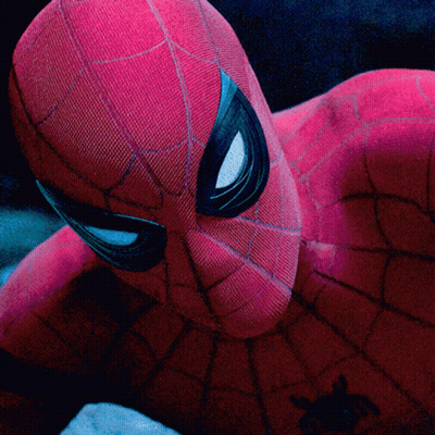 A Close Up Of A Spider Man 'S Face With A Spider On His Chest GIF