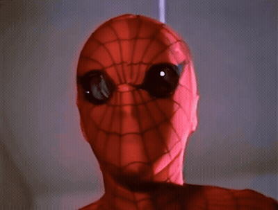 A Close Up Of A Spider Man 'S Face With Big Eyes GIF