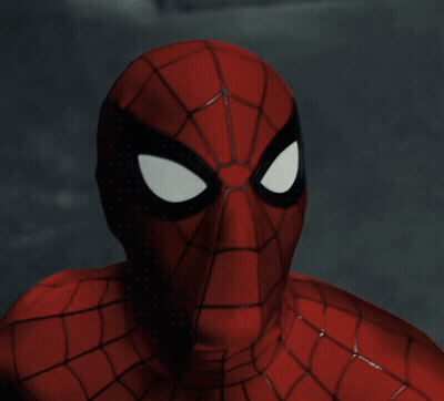 A Close Up Of A Spider Man 'S Face With Black Eyes GIF