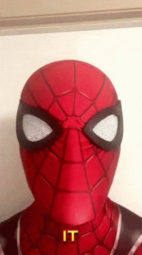 A Close Up Of A Spider Man 'S Face With The Word " It " On It GIF