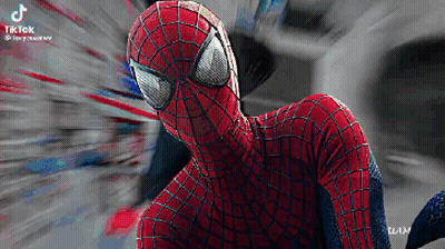 A Close Up Of A Spiderman Costume With A Blurry Background . GIF