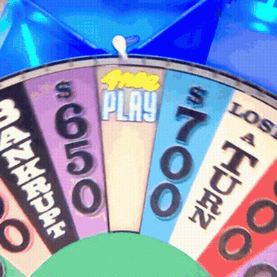 A Close Up Of A Spinning Wheel That Says $ 700 Play GIF