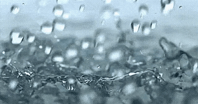 A Close Up Of A Splash Of Water With Bubbles GIF