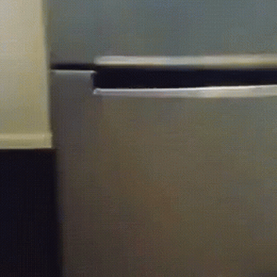 A Close Up Of A Stainless Steel Refrigerator With The Door Open GIF