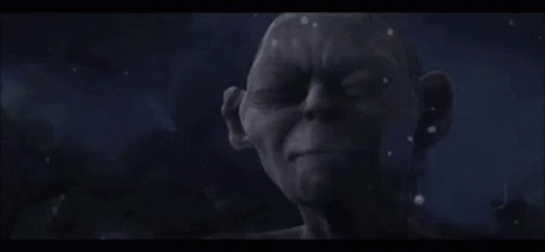 A Close Up Of A Statue Of A Man With His Eyes Closed And The Word Patience Written On It . GIF