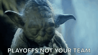 A Close Up Of A Statue Of Yoda With The Words Playoffs Not Your Team Written Below Him . GIF