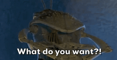 A Close Up Of A Statue With The Words What Do You Want Written On It GIF