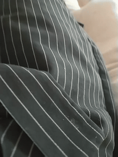 A Close Up Of A Striped Shirt With White Stripes On It GIF