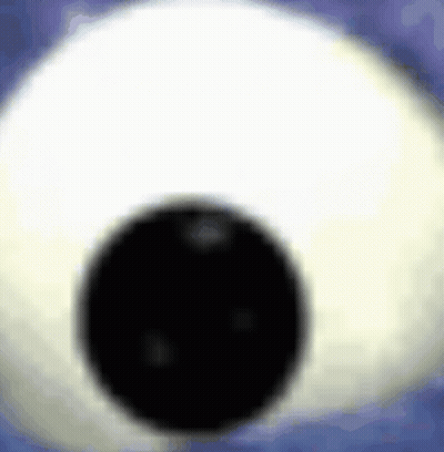 A Close Up Of A Stuffed Animal Eye With A Black Pupil . GIF