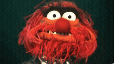 A Close Up Of A Stuffed Animal With A Big Mouth GIF