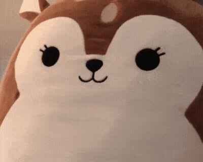 A Close Up Of A Stuffed Animal With A Squirrel Face GIF